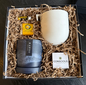 Gift set with planters, soap, lip balm and a tree in a box labeled 'Conscious Collective'.