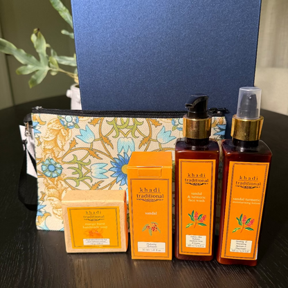 Collection of Khadi traditional skincare products on a dark surface with a blue box in the background.