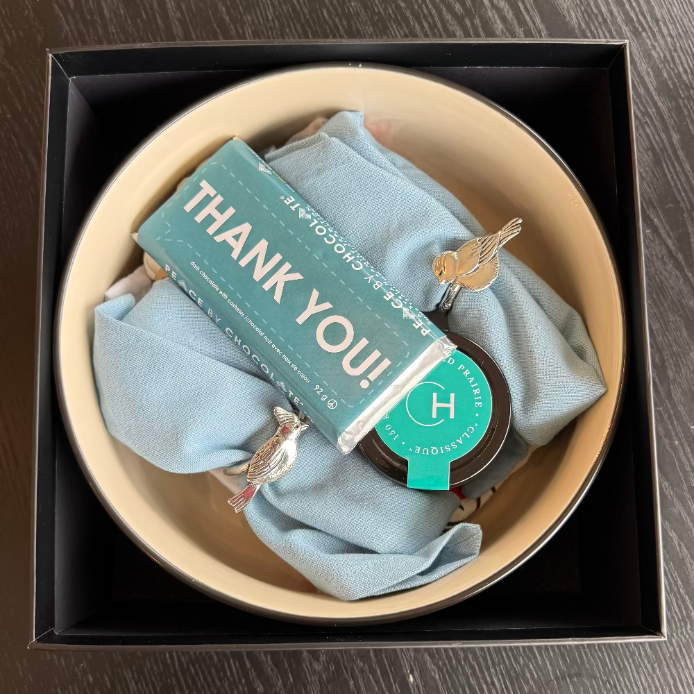 Gift set with 'THANK YOU!' card, chocolate, and bird figurine in a box.